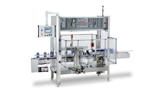 Industrial automatic labeling machine with a conveyor system.
