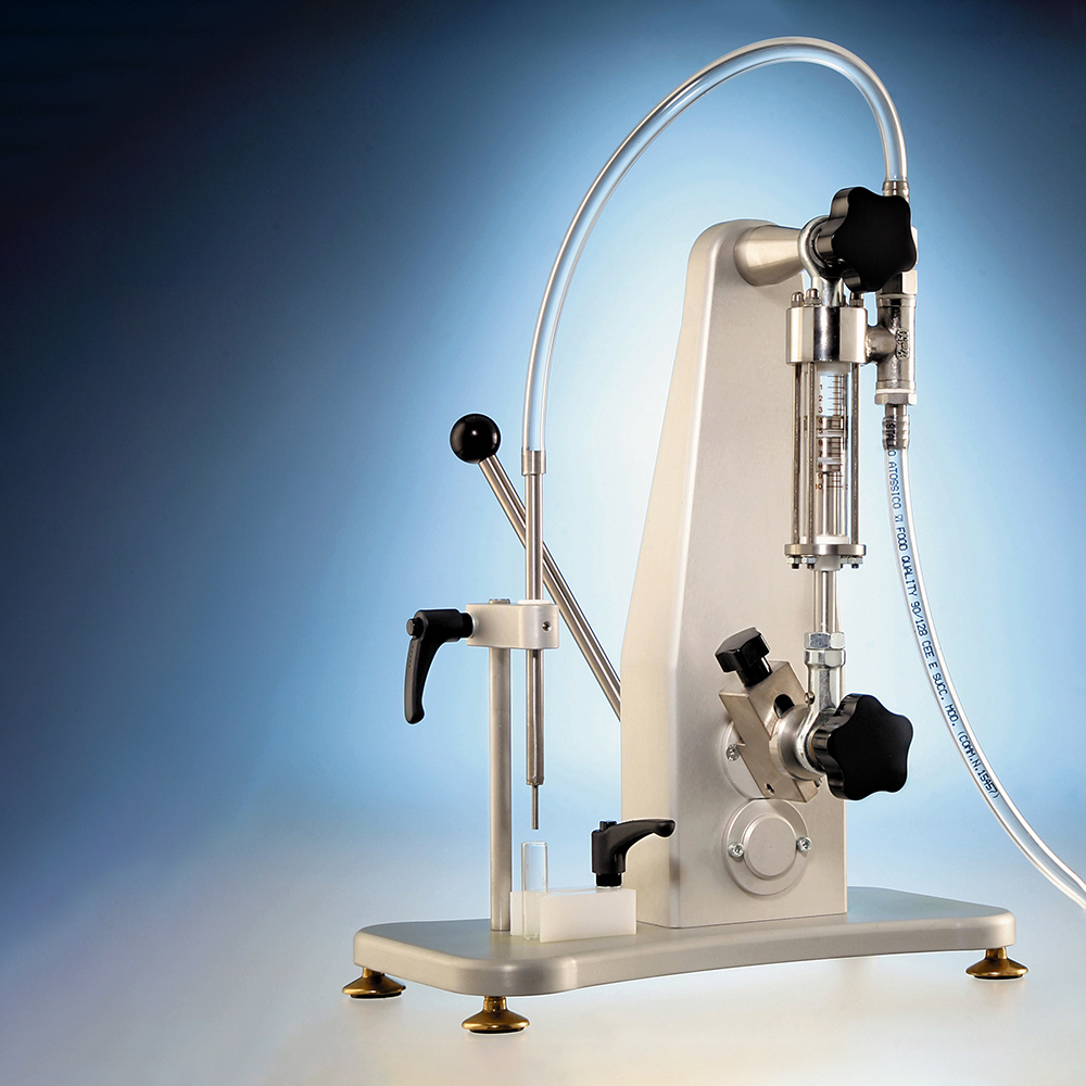 A laboratory bottle-top dispenser stand with a glass syringe.