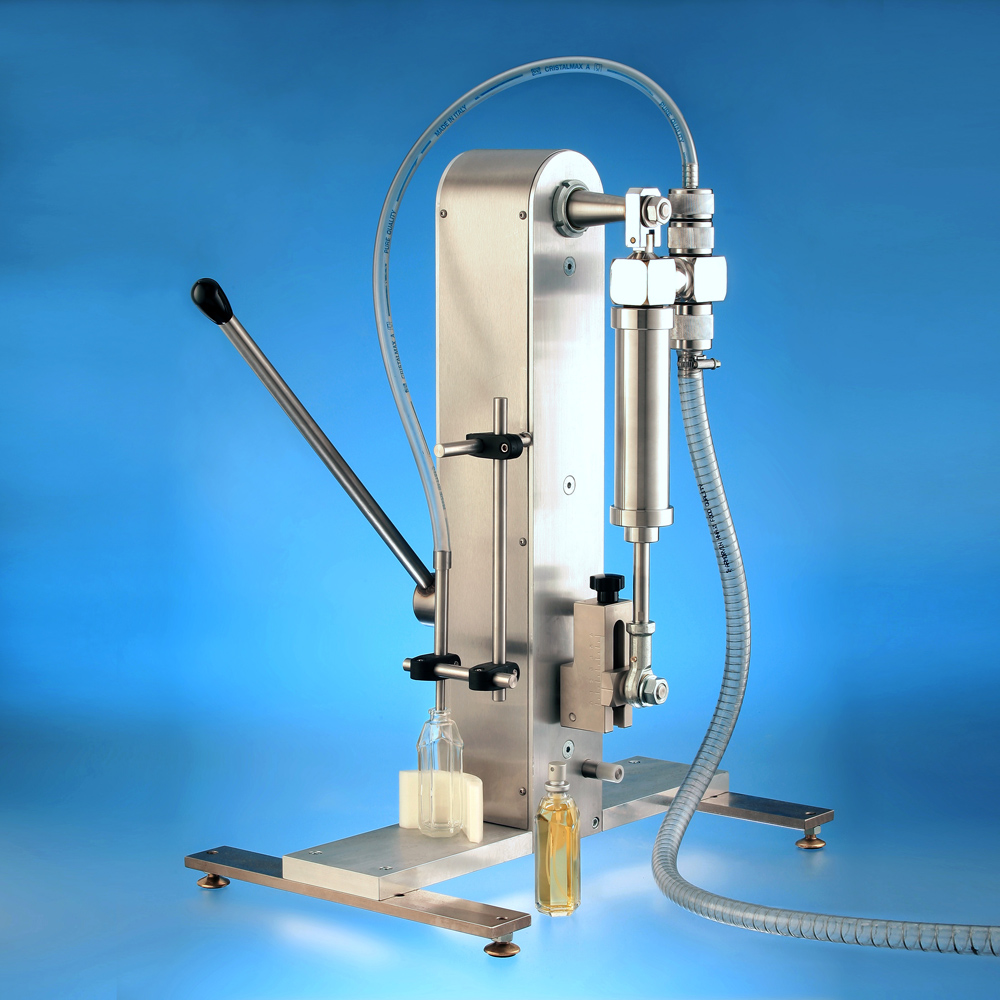 A manual, stainless steel liquid filling machine on a stand with a pump.