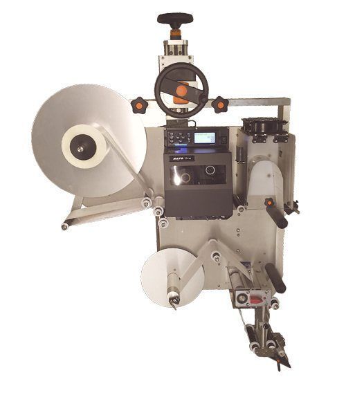 Industrial label applicator machine with a large supply roll.
