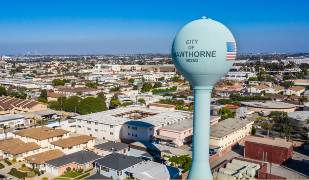 An aerial view of a water tower in the city of hawthorne