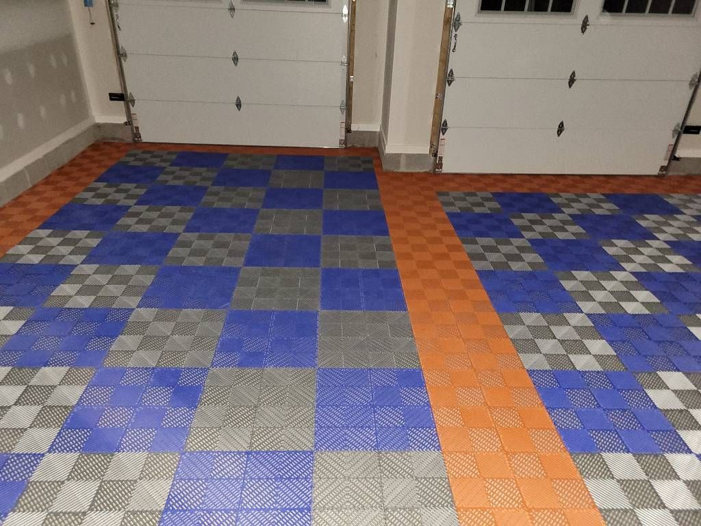 A garage with padded flooring by Floor Source