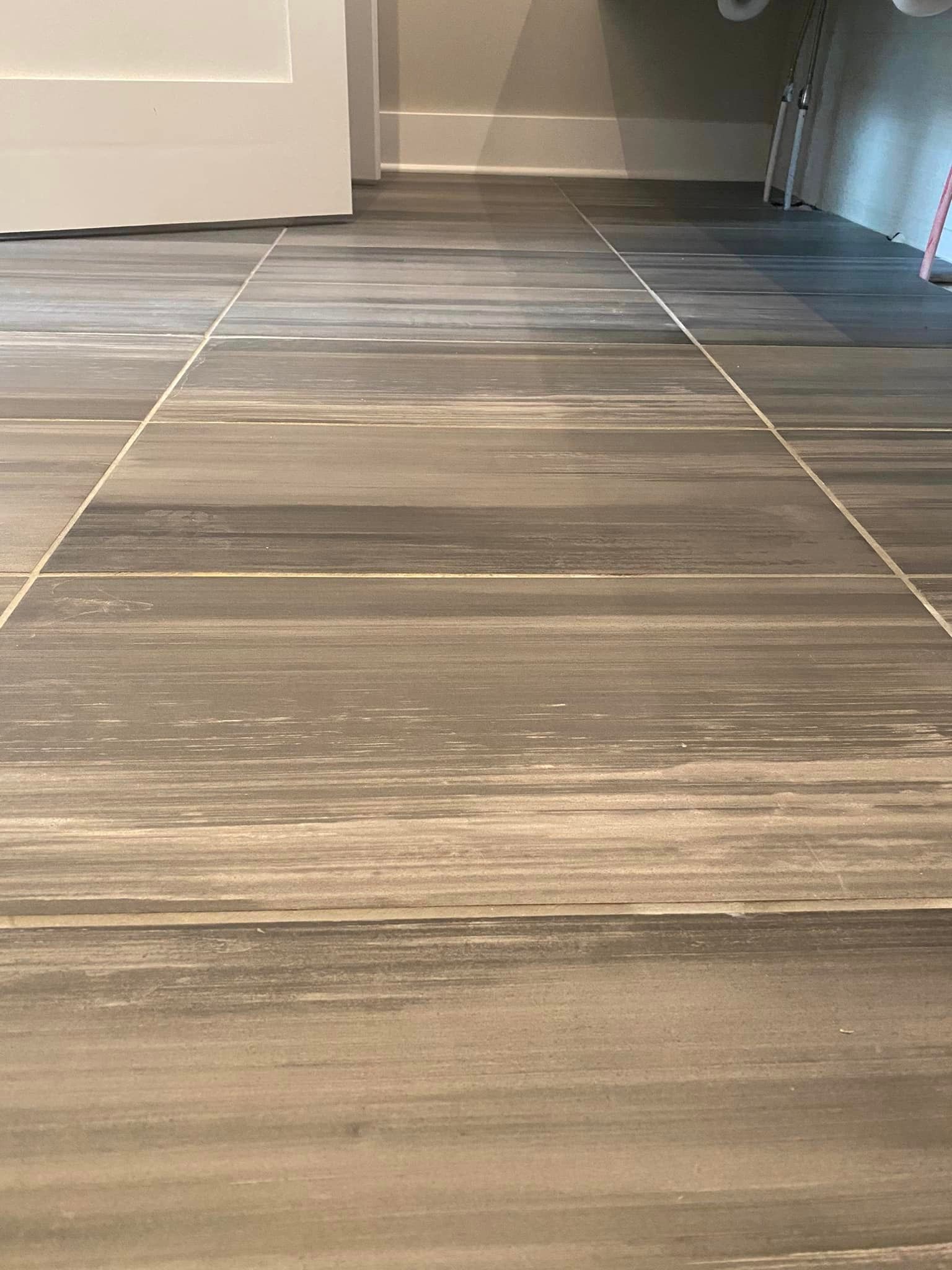 A close up of a tiled floor in a bathroom by Floor Source