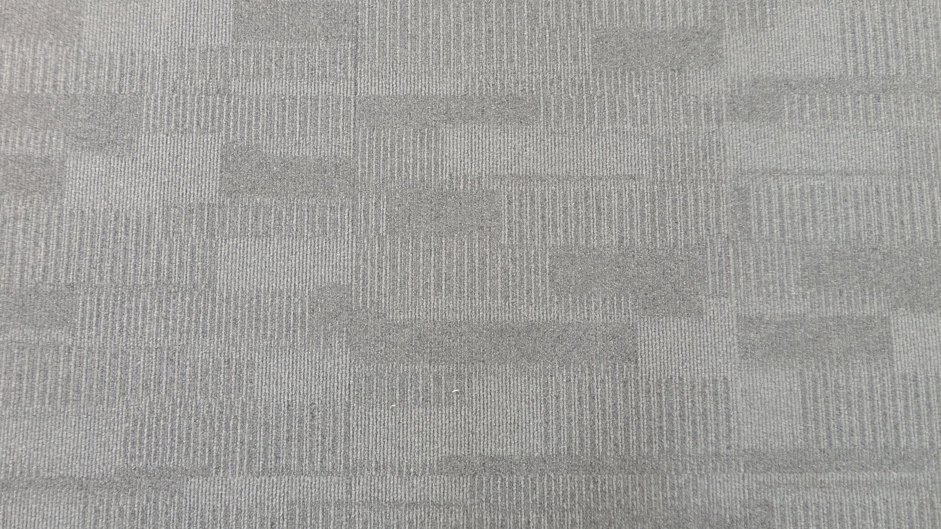 A close up of a gray fabric with a pattern on it.
