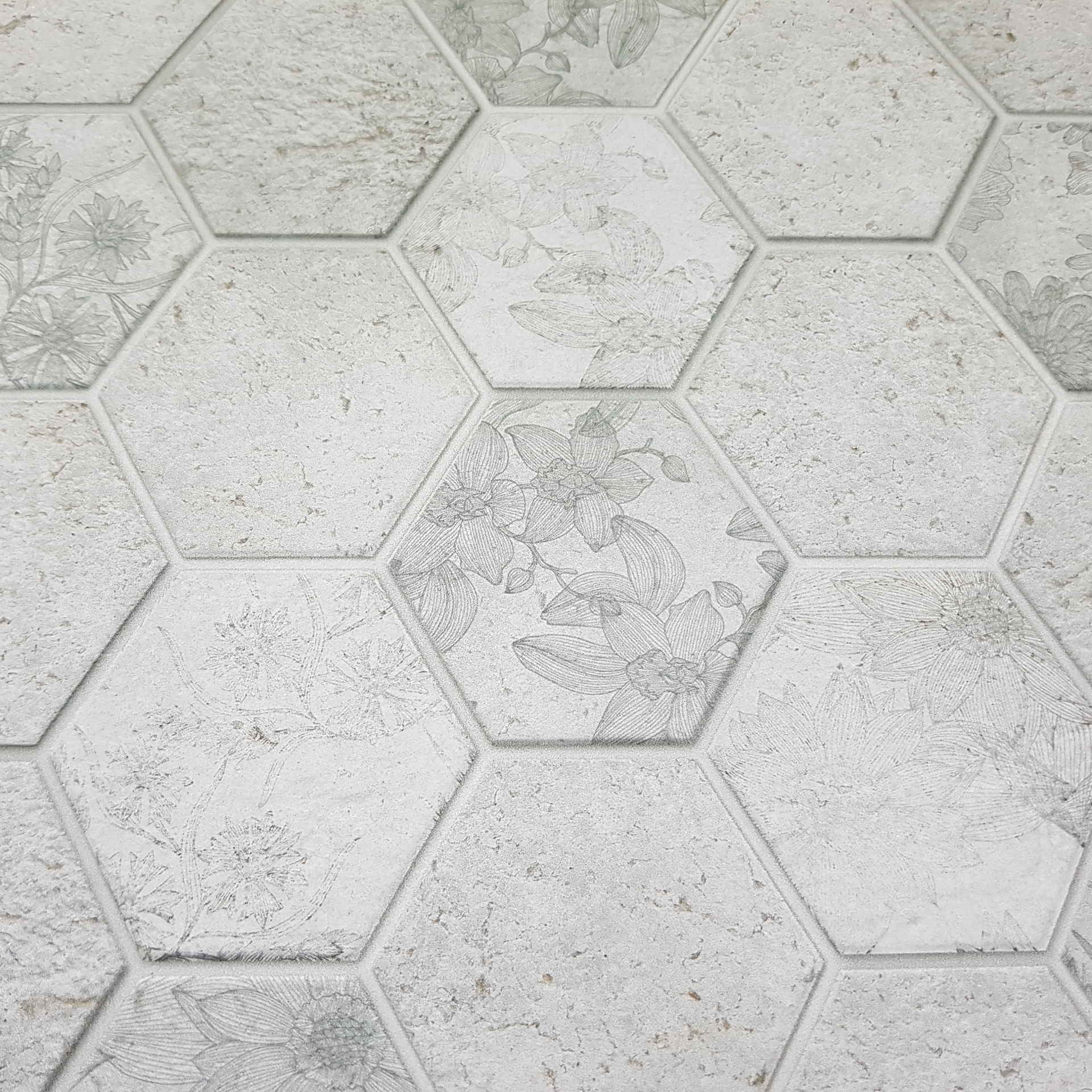 A close up of a white hexagonal tile floor