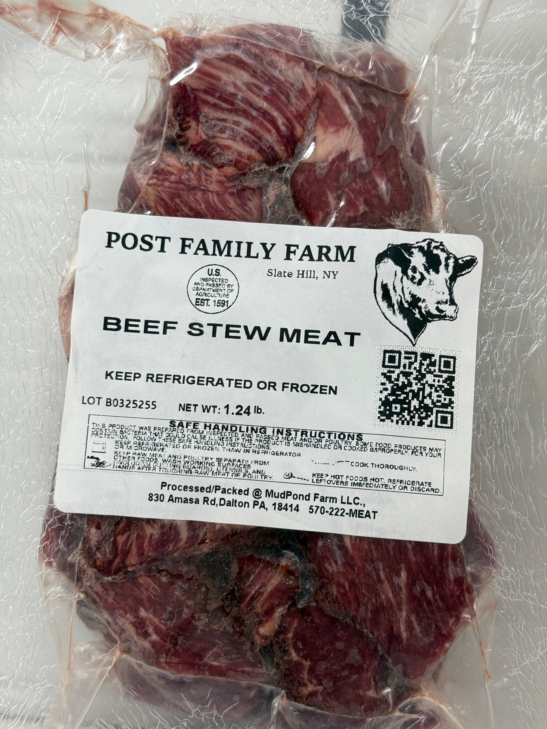 Beef stew meat packaged in plastic with a Post Family Farm label.