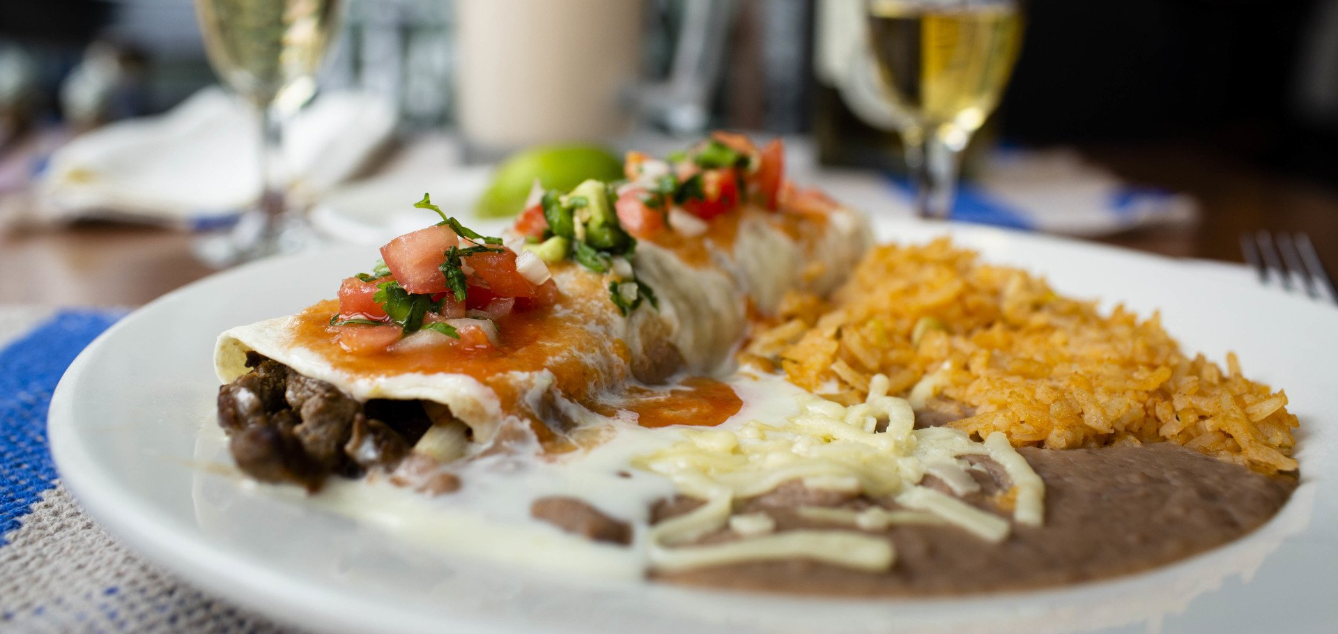 A close up of a plate of mexican food on a table.