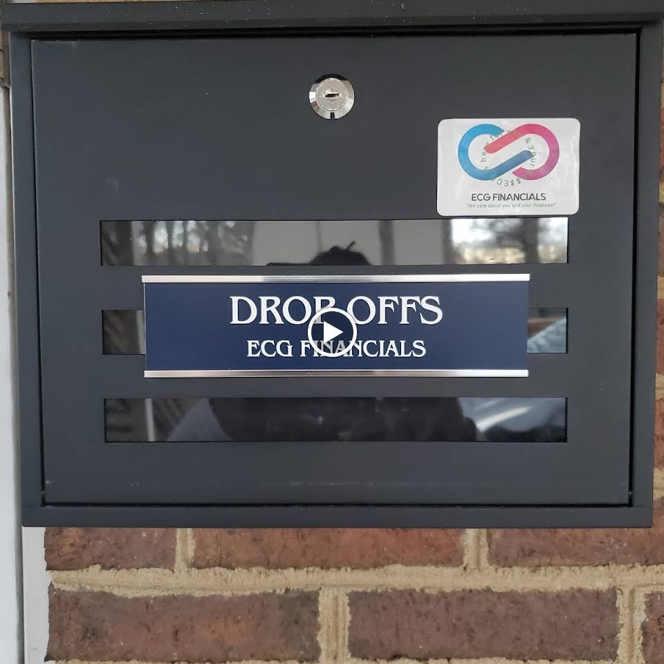 A black mailbox with a sign that says dropoffs ecg financials