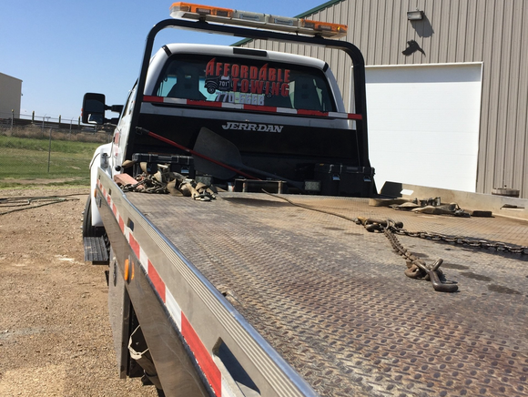 hauling a car - towing service in Williston, ND
