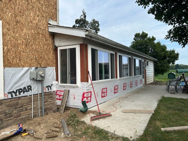 A house with a lot of windows is being remodeled.
