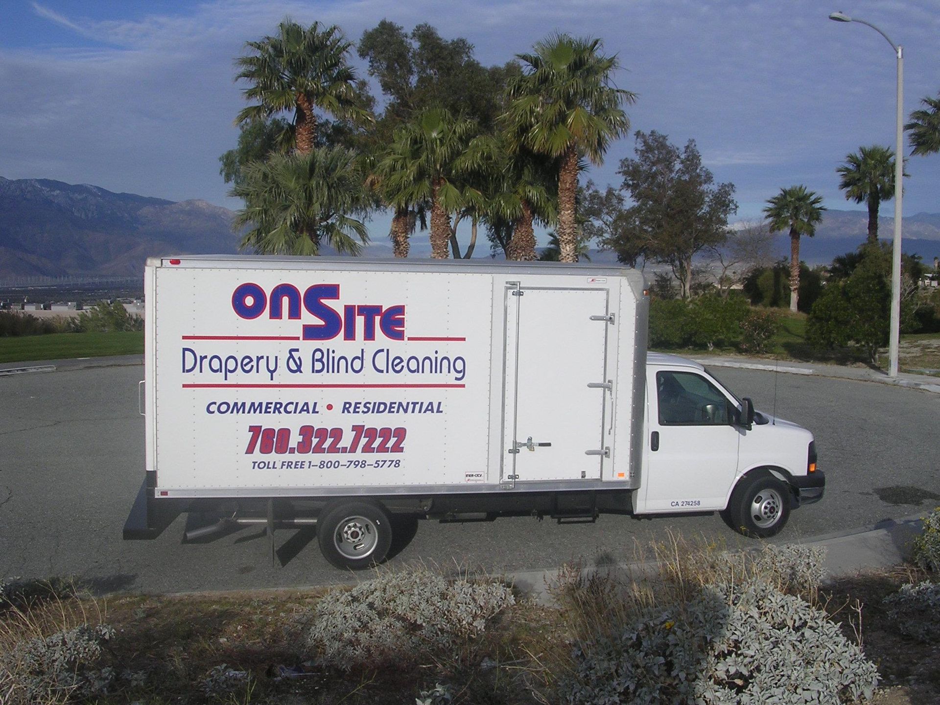 A white truck that says onsite drapery and blind cleaning