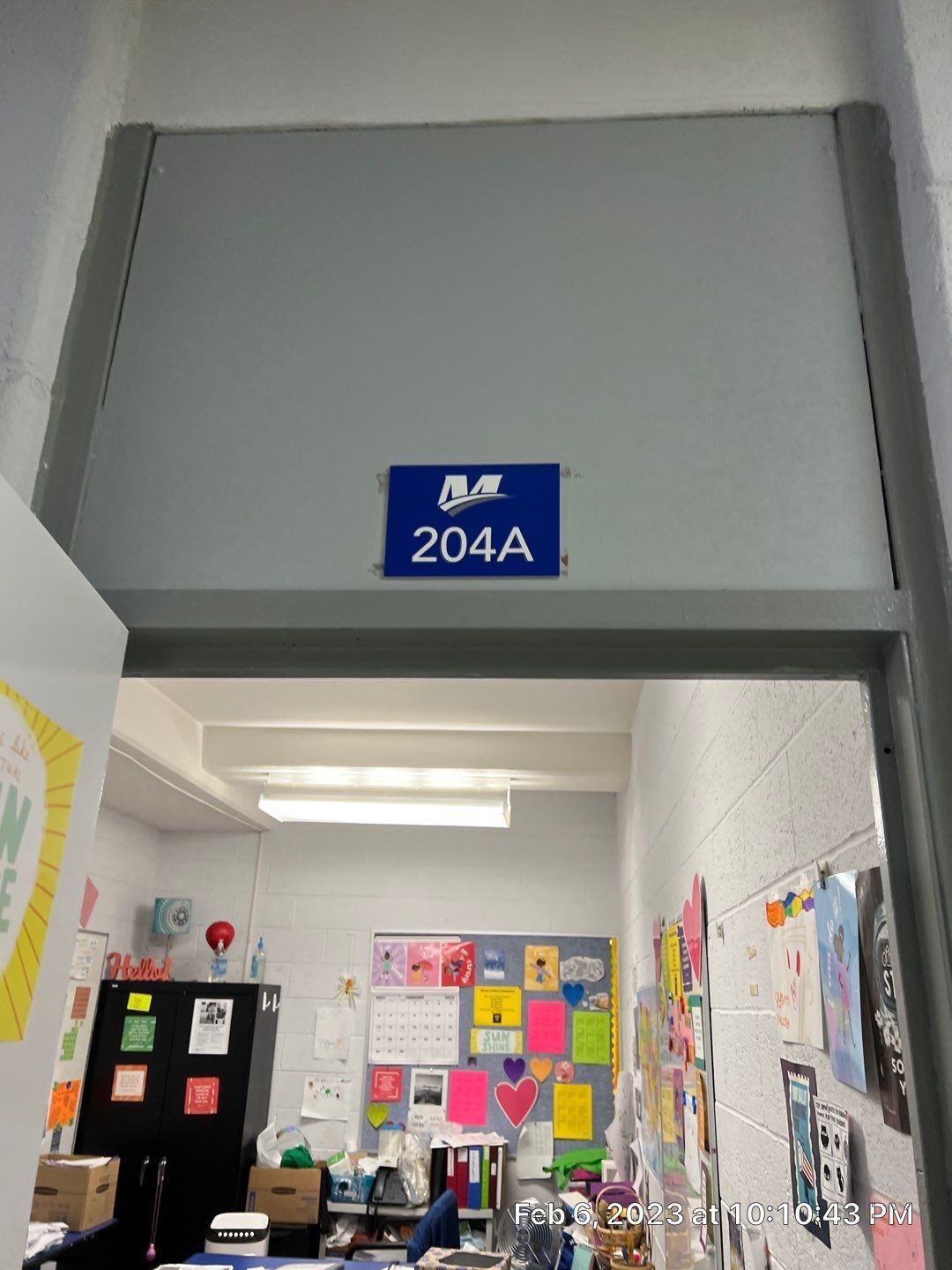 A classroom with a blue sign that says 204a on it.