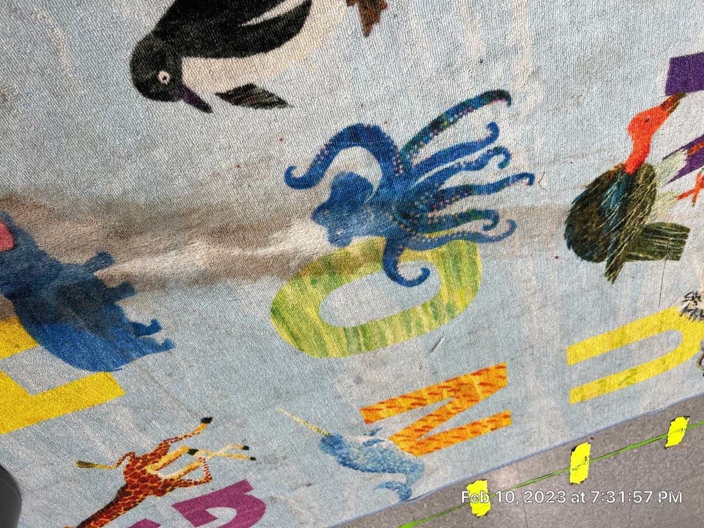A close up of a painting of animals on a wall