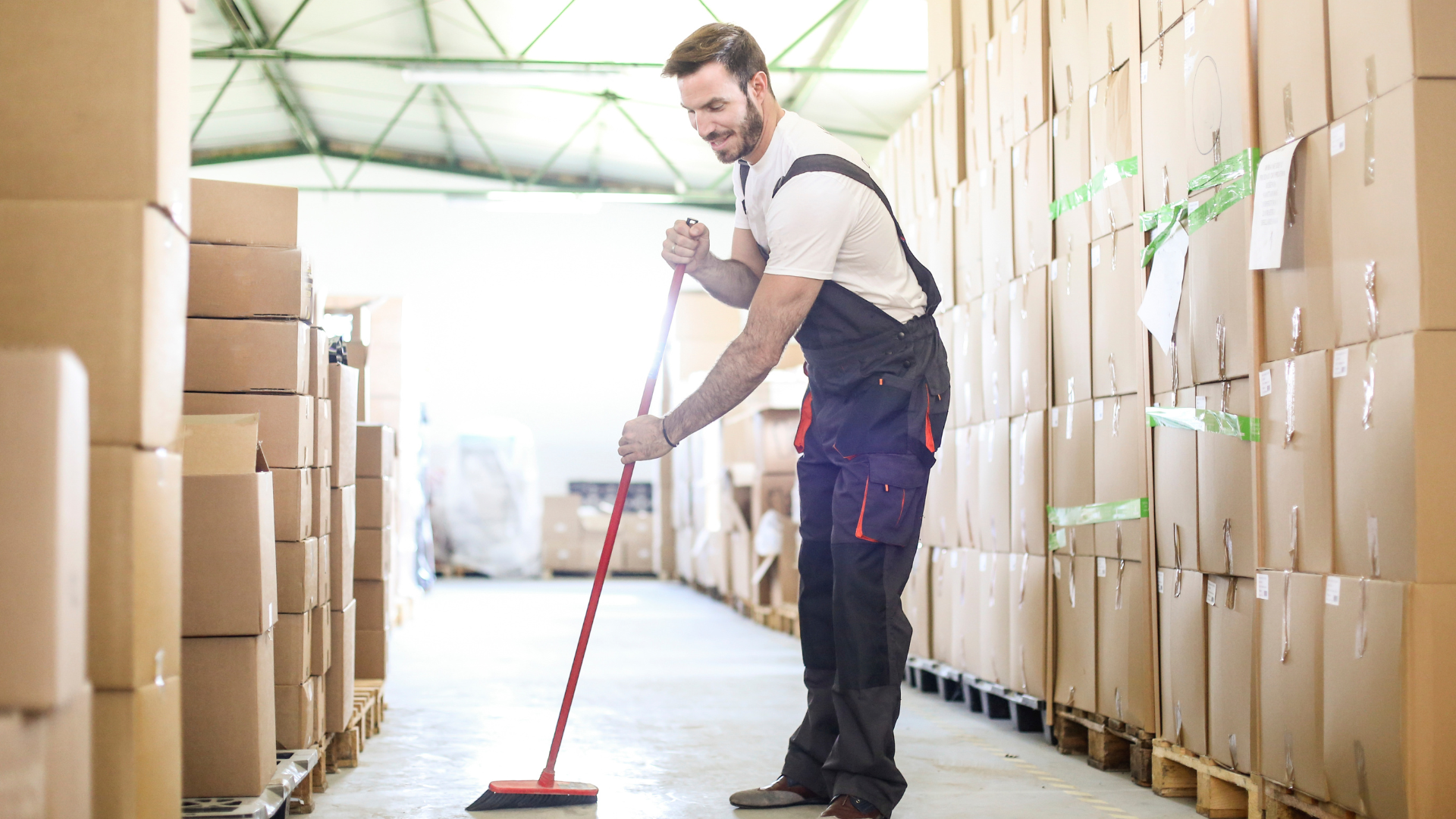 A warehouse floor care machine is sitting in a warehouse