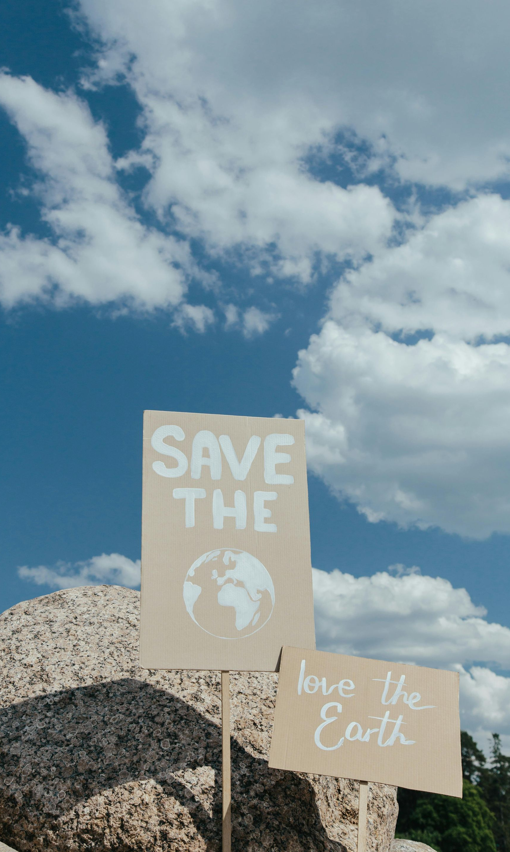 Two signs with handwritten messages,