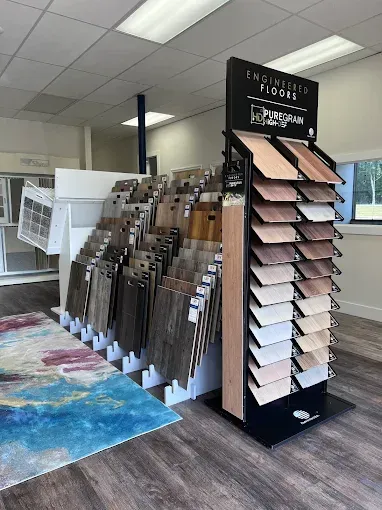Flooring showroom: Displays of wood flooring samples in various colors and styles.