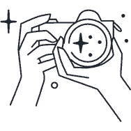 A person is holding a camera in their hands.