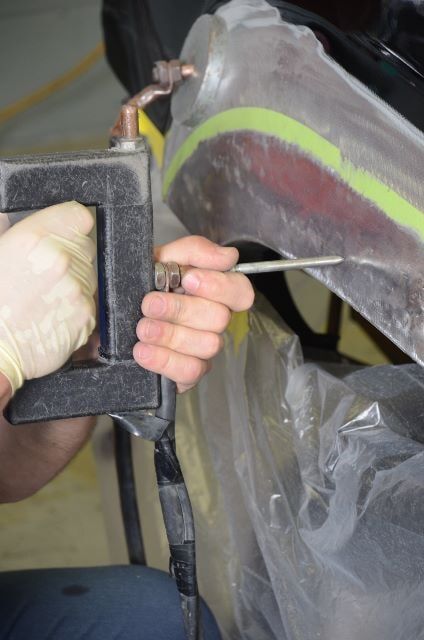 Man Using a Power Tool to Repair a Car — Auto Repair in Braintree,, MA