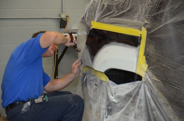 Man Repairing a Dent — Auto Repair in Braintree,, MA
