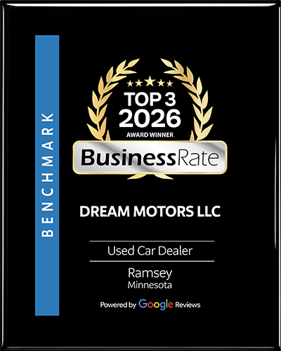 A black award plaque for Dream Motors LLC, a top-rated used car dealer in Ramsey, Minnesota, powered by Google Reviews.