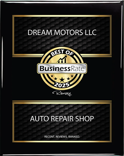 A black and gold award plaque for Dream Motors LLC, named 2025 Best of BusinessRate Auto Repair Shop.