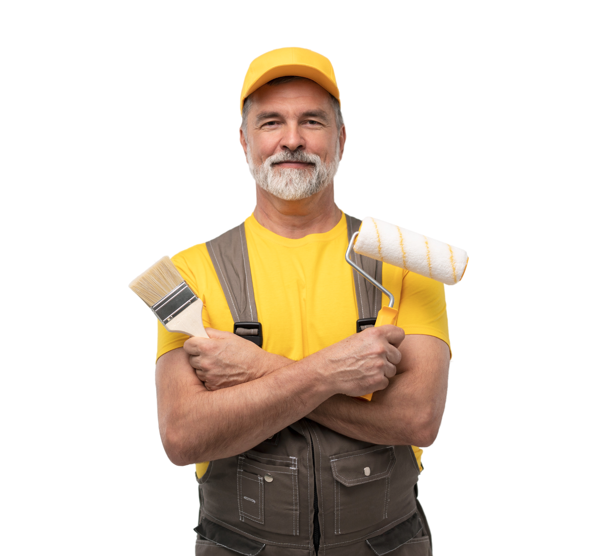 Painter in yellow cap and shirt holding paintbrushes and smiling on a white background