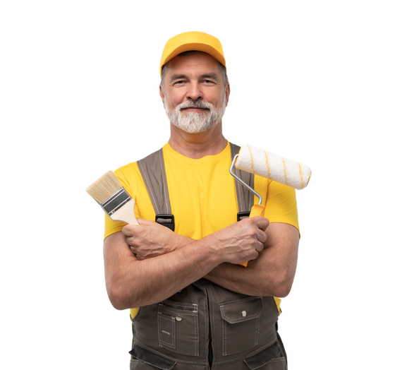 Painter in yellow cap and shirt holding paintbrushes and smiling on a white background