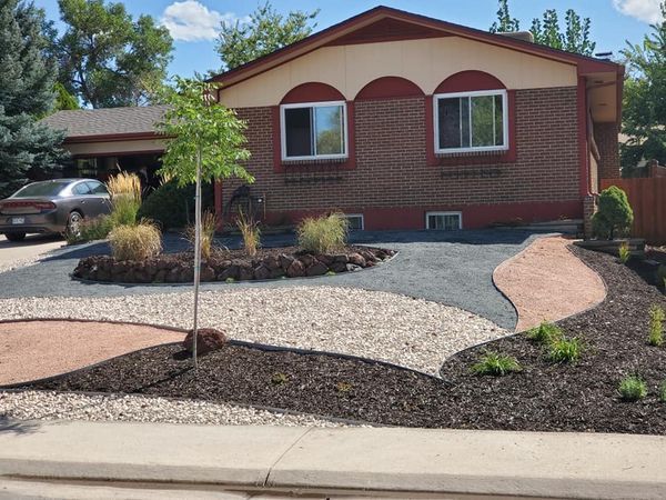 A house with a car parked in front of it