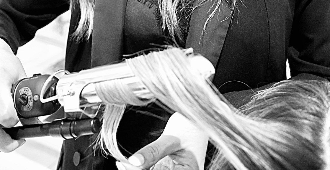 Hair stylists curling hair