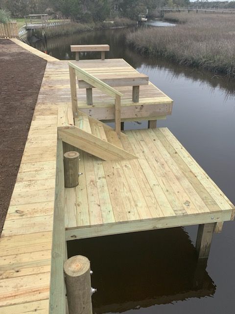 A wooden dock overlooking a body of water.