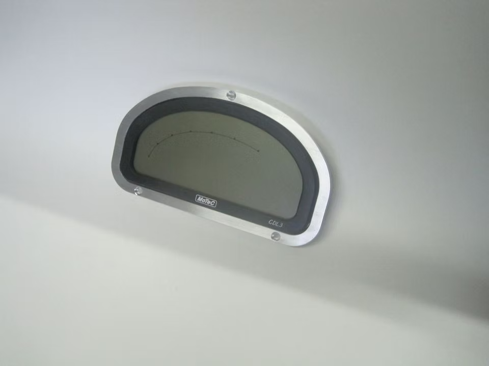 A billet dash mount bezel made by Precision Metal Craft for a MoTeC CDL3.