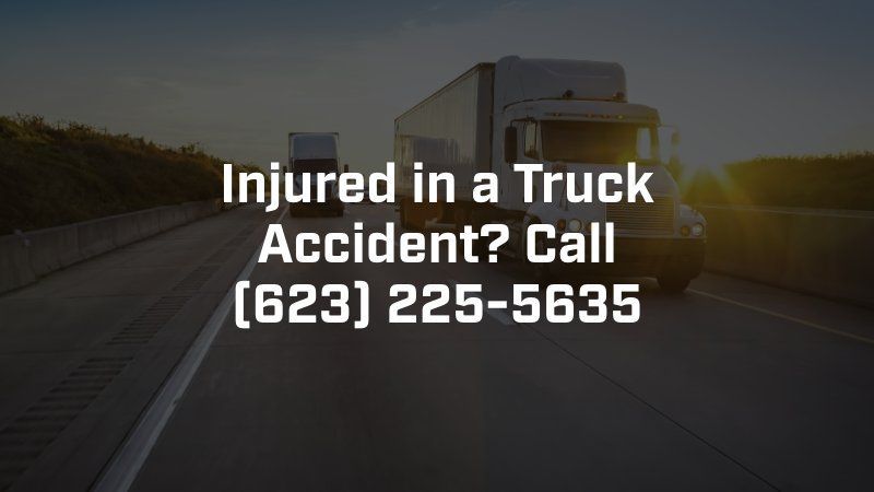 A truck is driving down a highway with the words injured in a truck accident call