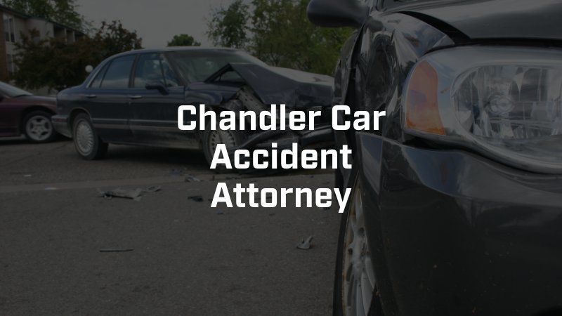A chandler car accident attorney is standing next to a damaged car.