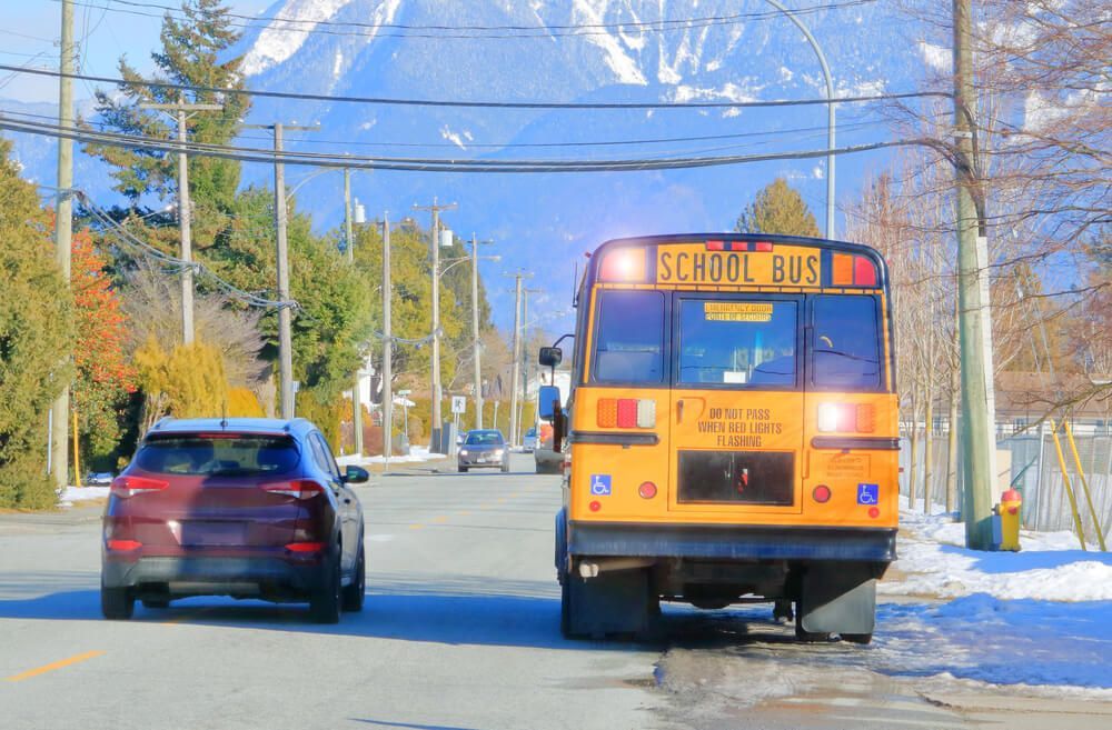 Stops on busy roads can cause school bus accidents. 