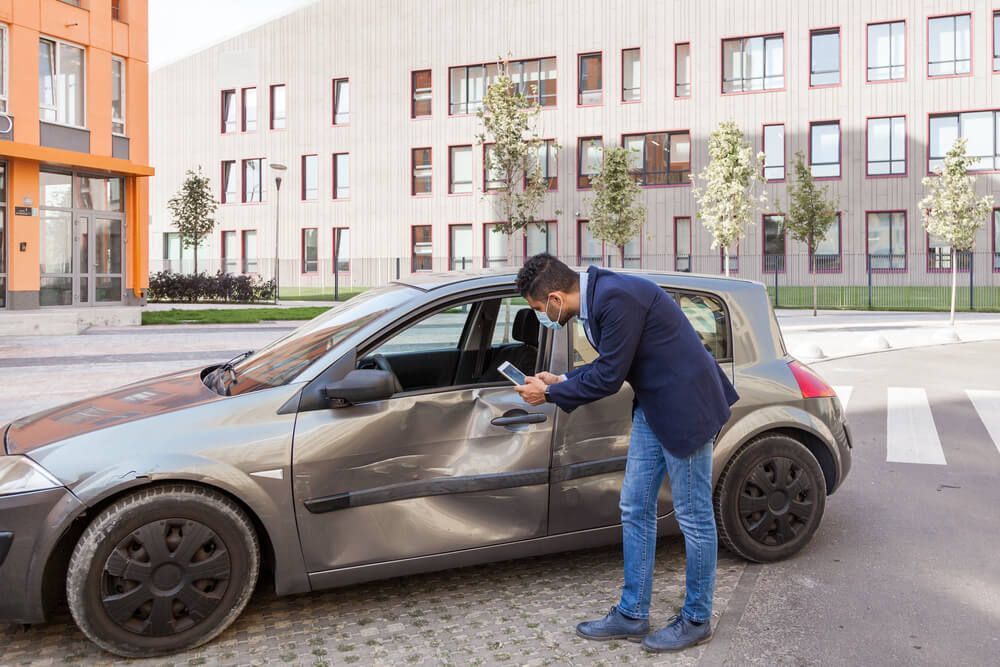 What do I do if my car was hit while parked on the street?