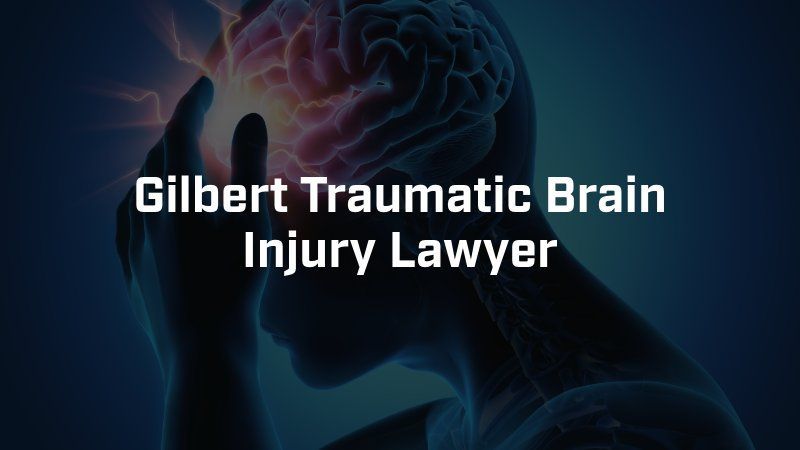 A person with a brain injury is holding their head in pain.