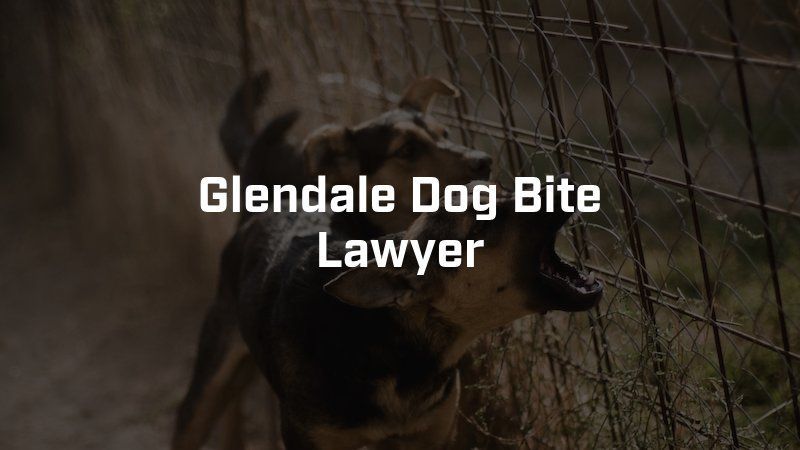 A dog is behind a fence with its mouth open.