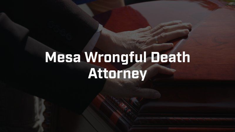 A man in a suit is putting his hands on a red coffin ..