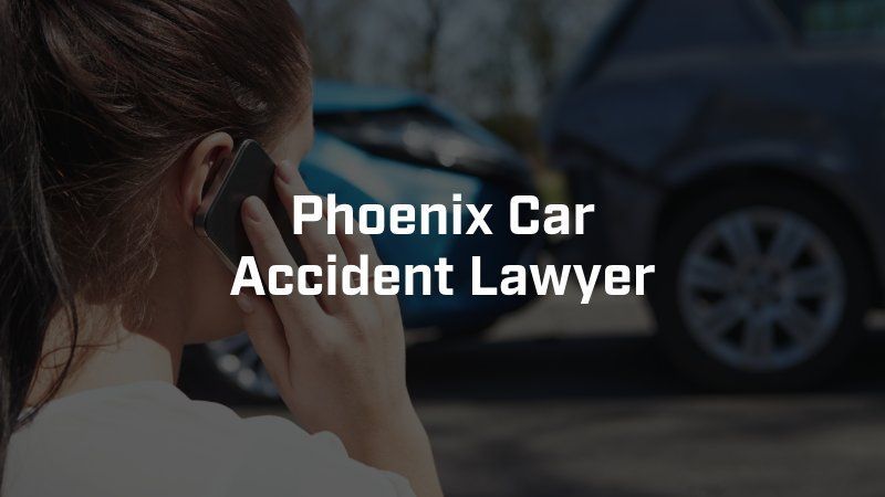 A woman is talking on a cell phone in front of a car accident.
