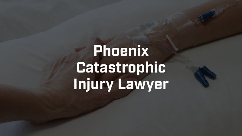 A phoenix catastrophic injury lawyer is holding a patient 's hand