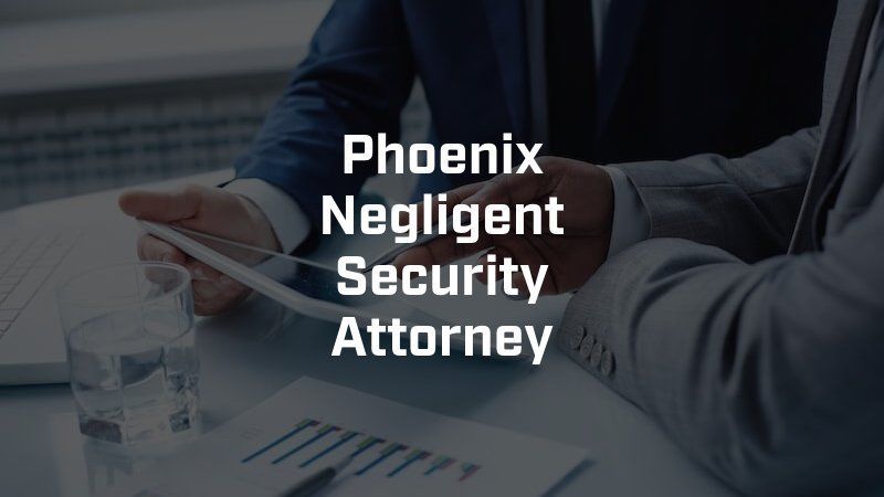 A phoenix negligent security attorney is sitting at a table with two men