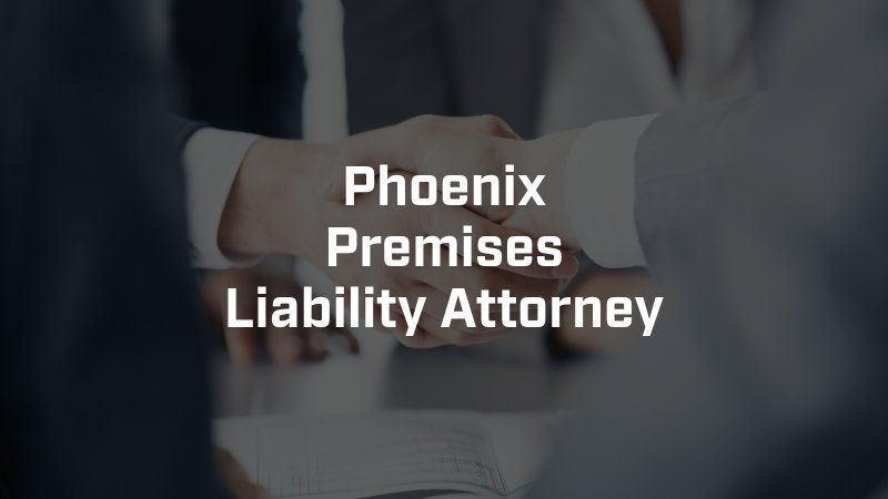 A phoenix premises liability attorney is shaking hands with a client