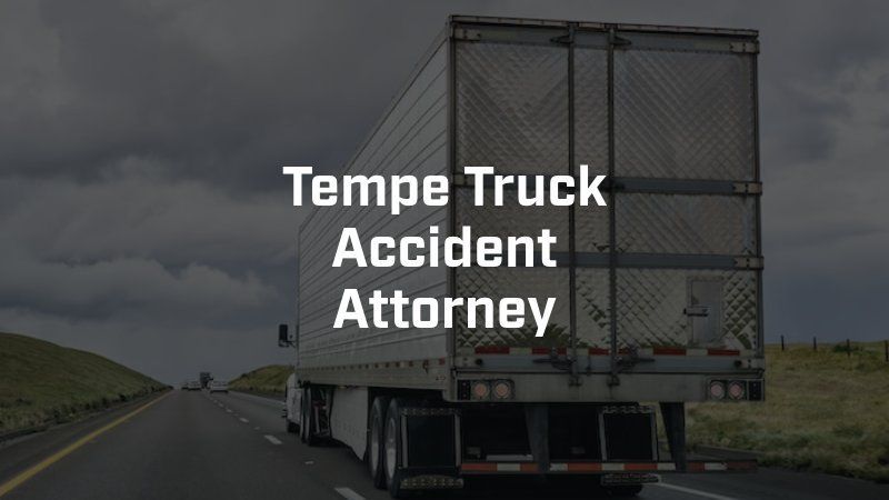 A truck is driving down a highway with the words
