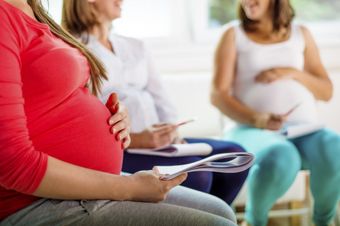Parenting Courses — Pregnant Holding Notes in Leesburg, FL