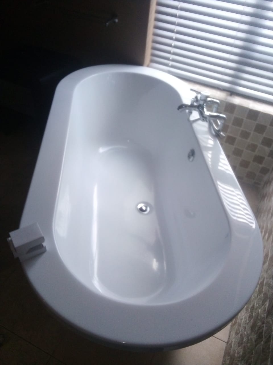 New white bathtub after installation