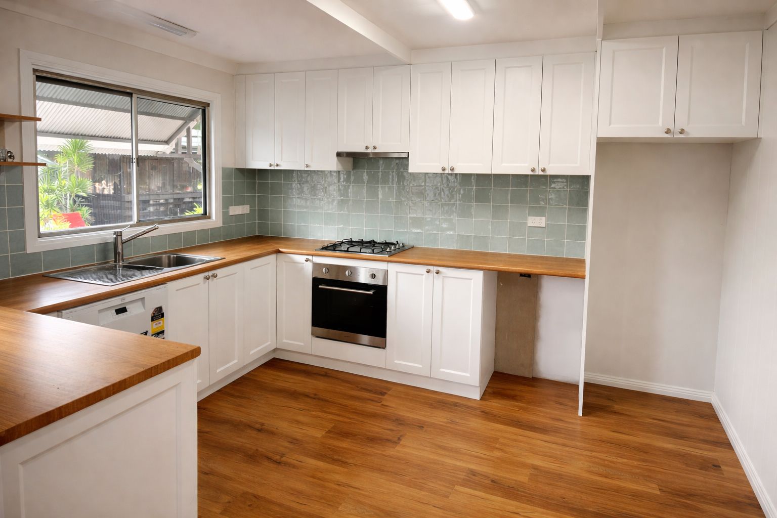 White Kitchen With Wooden Countertops and Floor  — My Coast Projects in West Gosford, NSW