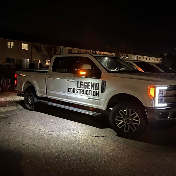 A white truck with legend construction written on it