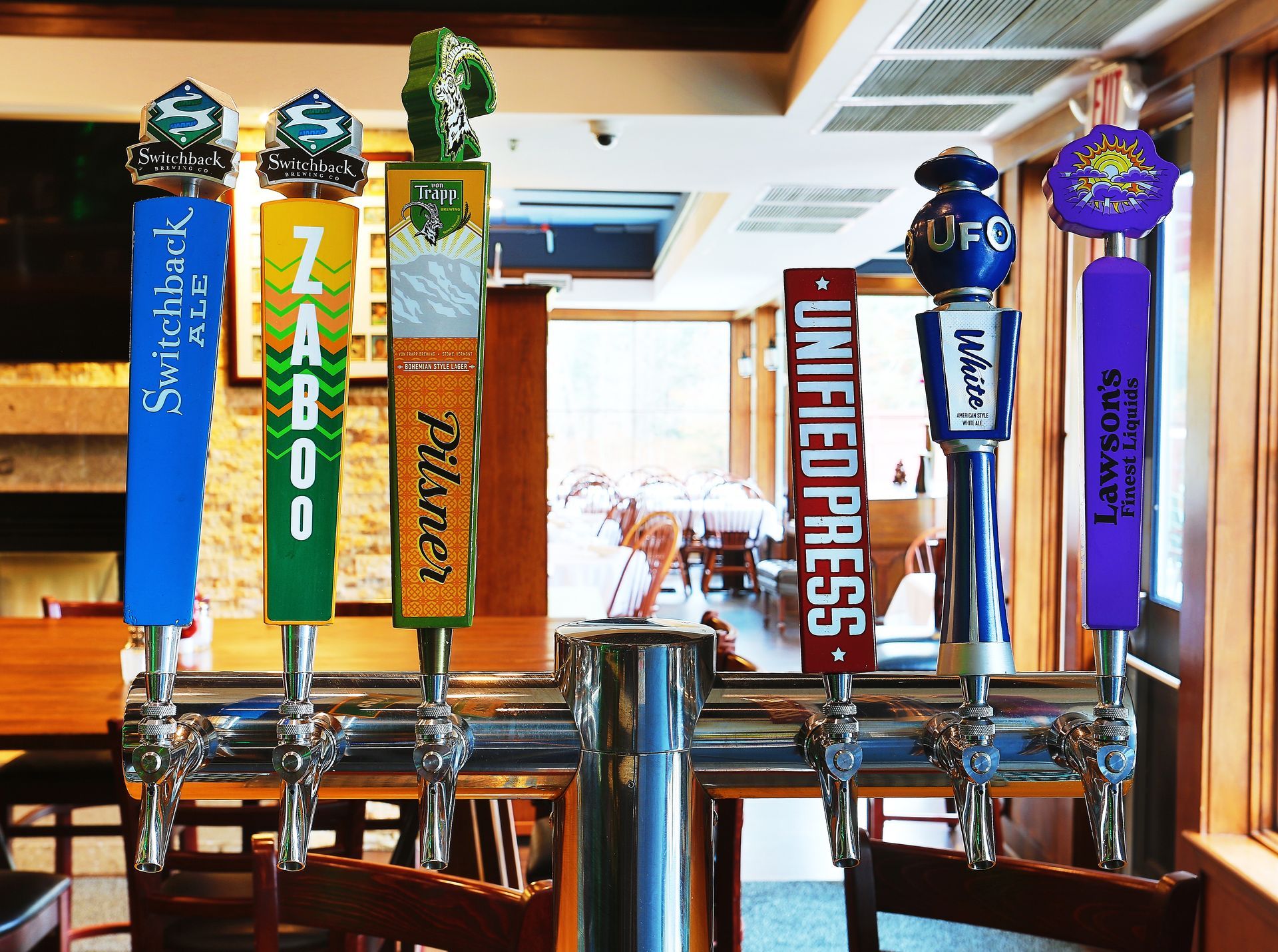 A row of beer taps including zaboo pilsner and united press