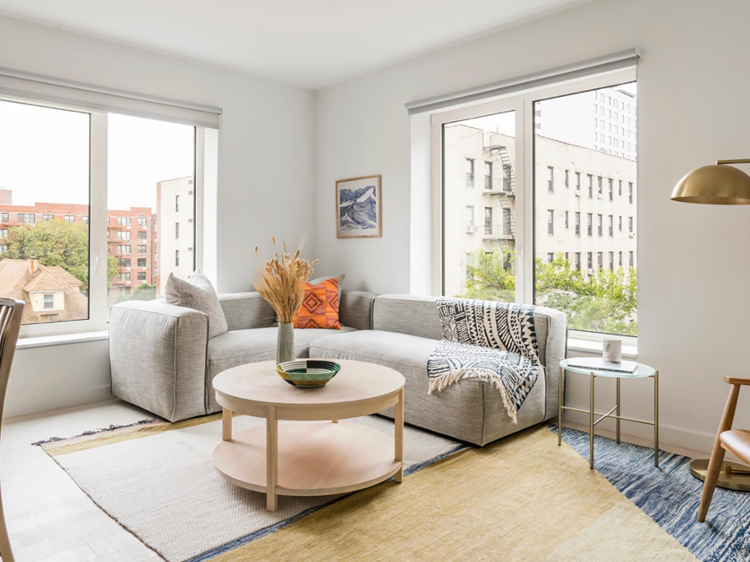 there is a couch and a coffee table in the living room .