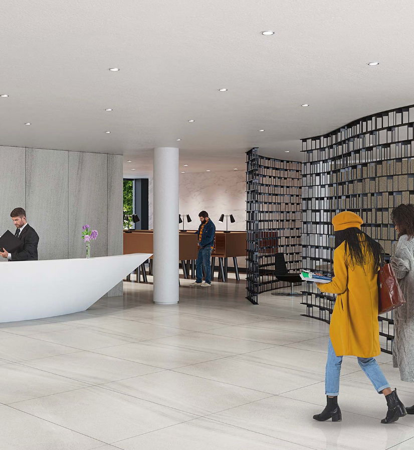 a woman in a yellow coat is walking in a lobby